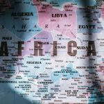 Closeup of map of Africa with countries borders and water on sunny day